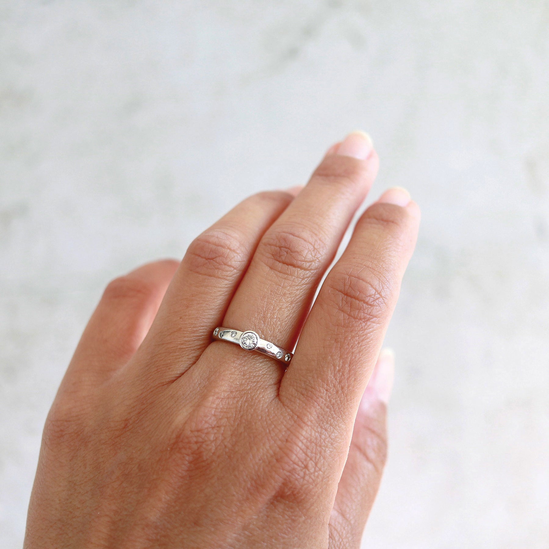 Platinum Bezel Set Inset Scattered Diamond Band